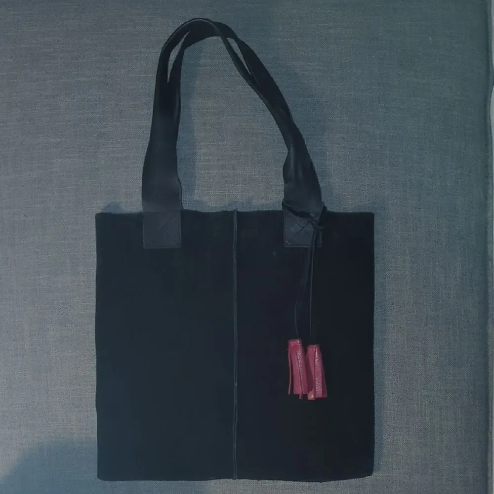 Black Suede Tote Bag with Red Leather Tassel Accents